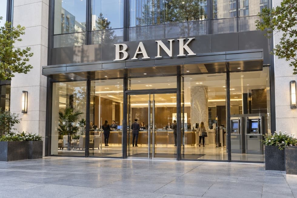 Entrance of a bank branch with ATMs beside the doors