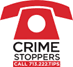 A red telephone with the words crime stoppers on it.