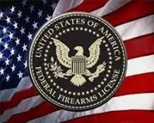 A federal firearms license seal is shown on an american flag.