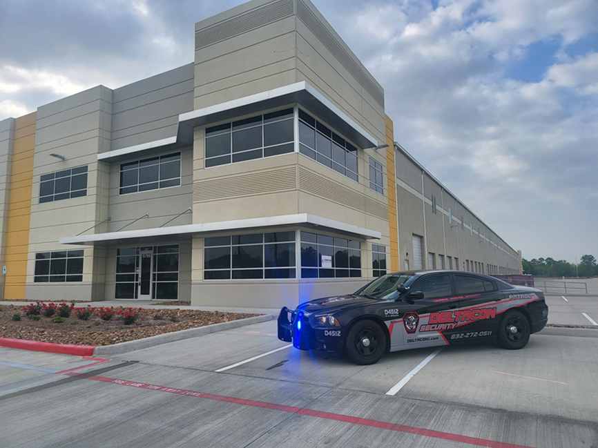 A police car parked in front of a building.