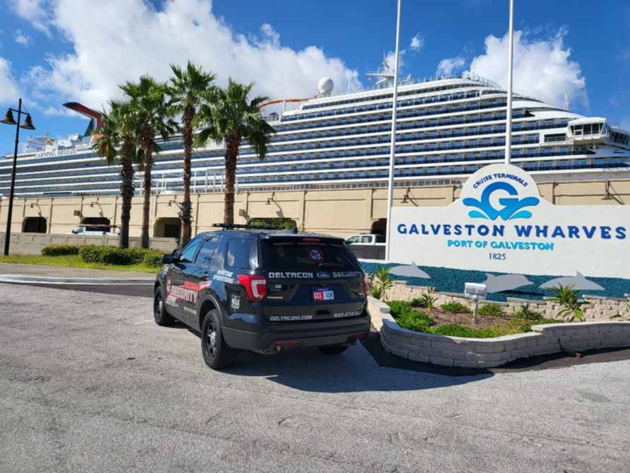 A black suv parked in front of the galveston whaler.